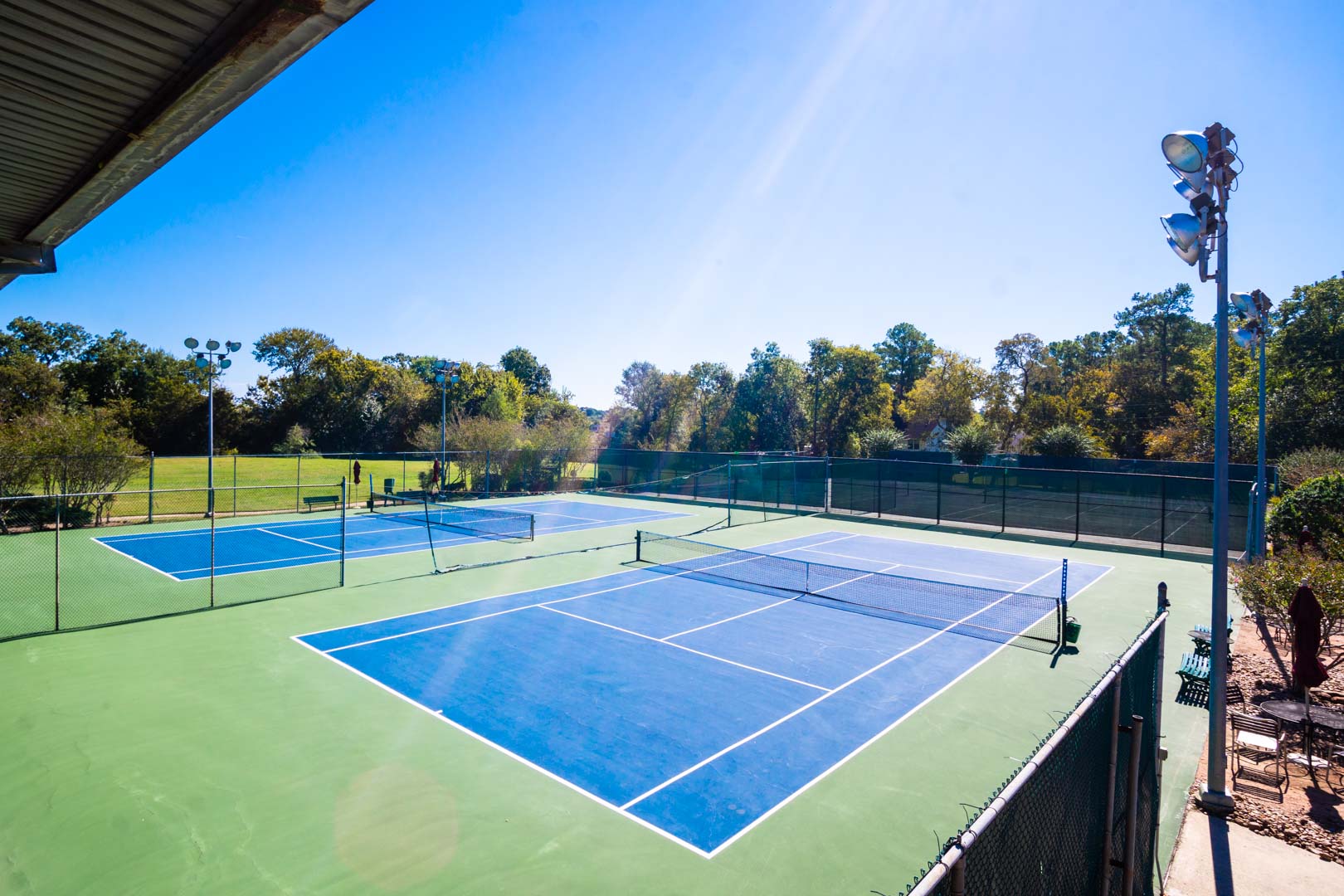 Two outdoor tennis courts for the family to enjoy at VRI's Sweetwater at Lake Conroe in Montgomery, TX.